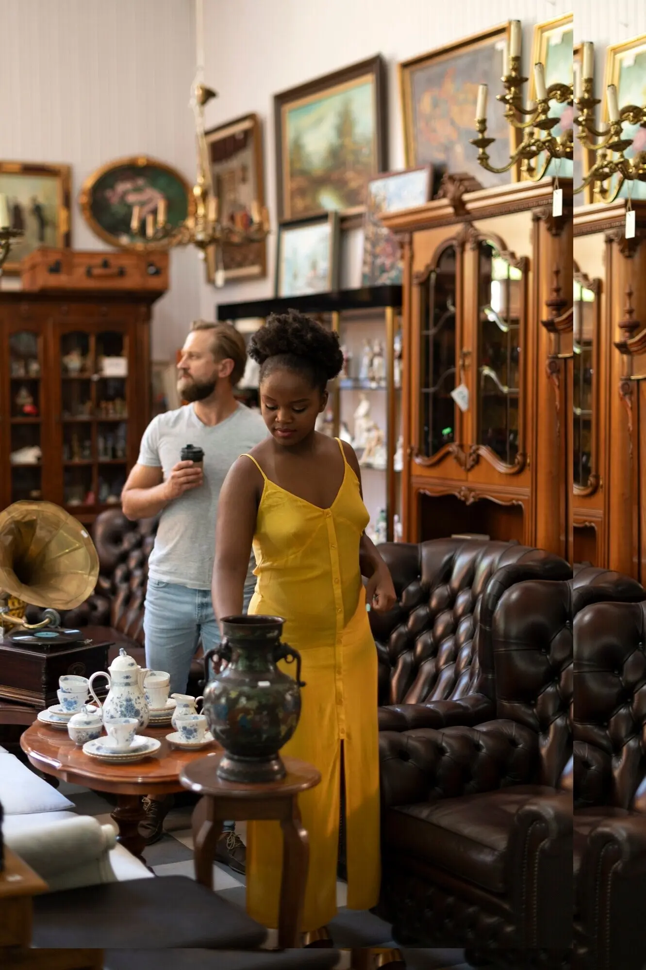 A full shot of people at the antique store.
